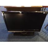 A 42" LG TV (sold as seen, with remote, no power cable)