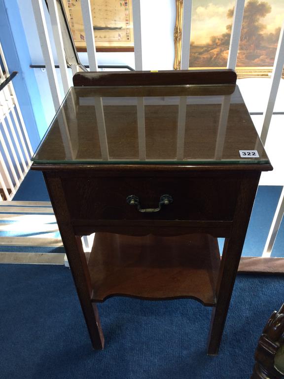 An mahogany bedside cabinet