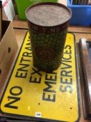 A 'No entrance except emergency services' sign and a decorative 'Natural No. 1 Peas' tin