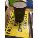 A 'No entrance except emergency services' sign and a decorative 'Natural No. 1 Peas' tin