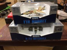 Two boxed model planes, F18 Hornet and B25 Mitchell