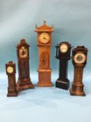 Five model long case clocks