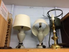 A shelf of assorted lamps