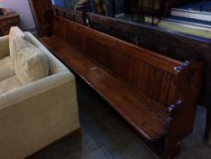 A pine pew, approx. 133 inches