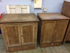 A pair of near pine cupboards