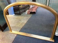 A gilt over mantle mirror