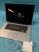 An Apple Mac book (sold as seen, spares and repairs)