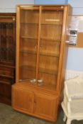 An Ercol Golden Dawn two door glazed display cabinet, 91cm wide