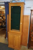 A pine gun cupboard with glazed top, 65cm wide