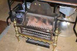 A cast iron and brass fire place