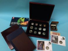 A collection of various modern cased commemorative coins