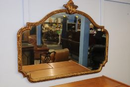 A modern gilt wall mirror