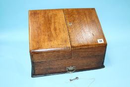 A 1920s oak stationary box, with fold out sides. 39cm wide