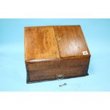 A 1920s oak stationary box, with fold out sides. 39cm wide