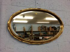 A gilt framed mirror