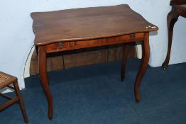 A Continental walnut single drawer side table