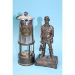 A Robert Olley Coal Mining figure and an Eccles Miners lamp