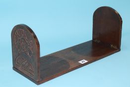 A carved oak book stand