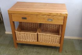 An oak two drawer kitchen unit