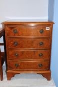 A small reproduction walnut chest of drawers, 46cm wide