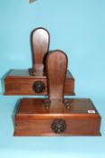 An unusual pair of mahogany plate/charger stands