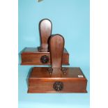 An unusual pair of mahogany plate/charger stands
