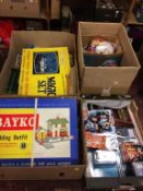 Four boxes of assorted toys and games