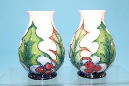 A small pair of modern Moorcroft 'Christmas' vases. 10cm high