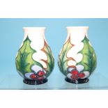 A small pair of modern Moorcroft 'Christmas' vases. 10cm high