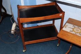 A teak two tier tea trolley