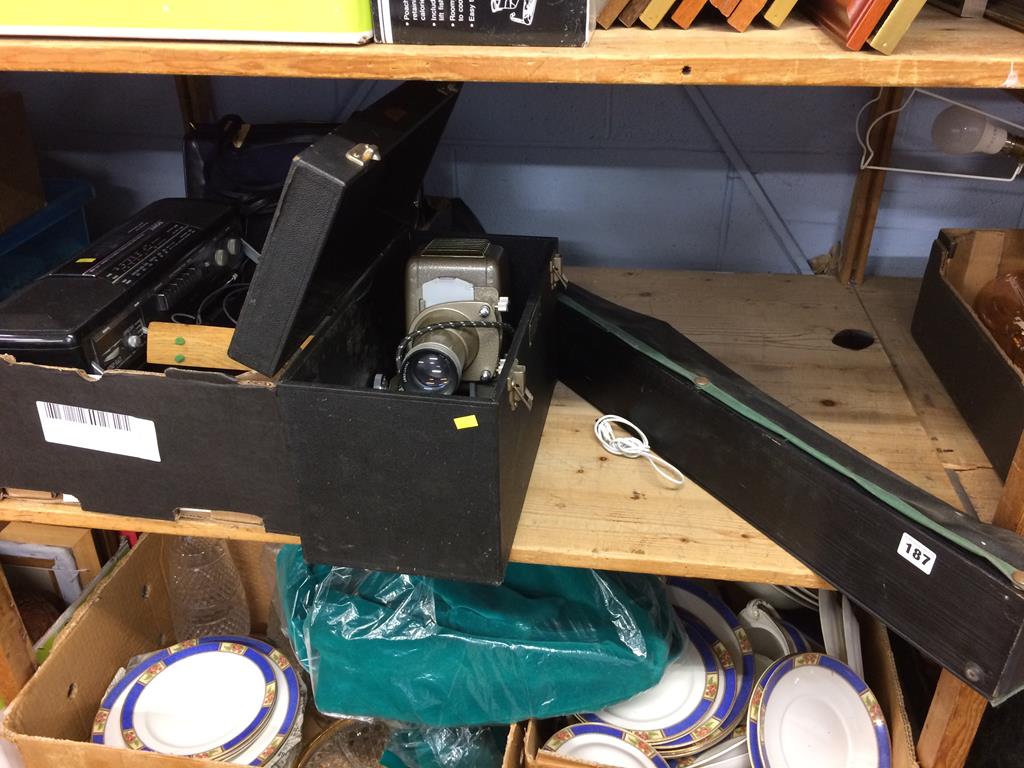 A tray of assorted, a projector and a screen