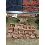 A large cast iron anvil and two weights, various