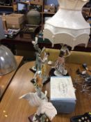 A collection of 'Armani' figures and a lamp