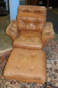 A tan brown leather armchair and footstool