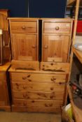 A pine dresser and three pine chest of drawers