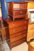 A Stag bedside drawers, a Stag chest of drawers and a reproduction mahogany bookcase