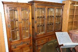 An oak Old Charm dresser and corner cabinet