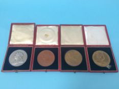 Two cased Coronation medals and a silver and a copper cased Jubilee medal