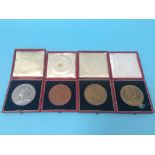 Two cased Coronation medals and a silver and a copper cased Jubilee medal