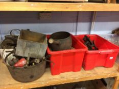 A shelf of assorted metalware