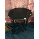 An Edwardian ebonised octagonal occasional table