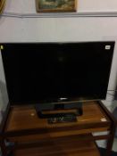A LG TV, with remote
