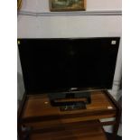 A LG TV, with remote