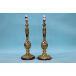 A pair of heavy ornate brass table lamps, 53cm height