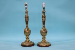 A pair of heavy ornate brass table lamps, 53cm height