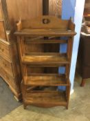 An oak four tier bookcase with open sides, 62cm width x 125cm height
