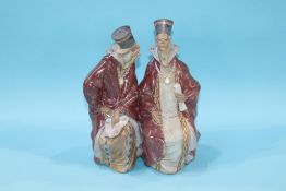 A Lladro group of two seated monks