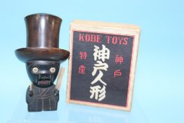 A hardwood boxed 'Kobe Toys' dice shaker, 11cm height x 7cm width approx.