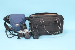 A Pentax MX camera and accessories