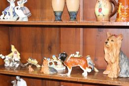 A Beswick Yorkshire Terrier, 2377, a smaller version 1944, a Beswick 'Corna Garth Stroller' and a